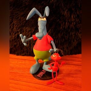 Aardvark action figure with green shorts pink panther